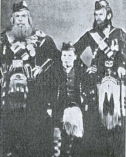 Donald Cameron, left, with his son Keith, right, and pupil Donald MacKay, a nephew of Angus MacKay.