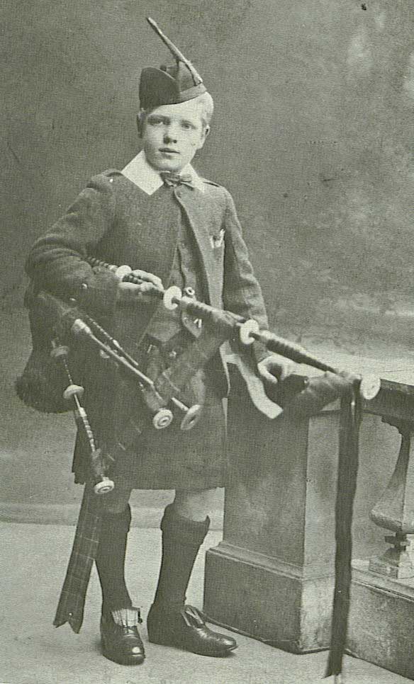 As a 10-year-old with his first set of pipes in 1916, and his left hand still intact.