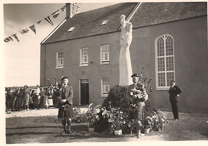 Playing with brother Roderick (left) at the unveiling of the Our Lady of the Isles monument in South Uist in 1957.